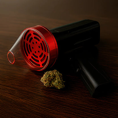 Angled close-up of the Cloudious9 The Auto9 Fully Automatic Grinder with a red translucent front piece and black body resting on a dark wood surface.