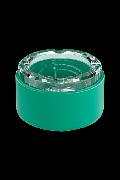 Green glass ashtray or stash jar with a textured, faceted lid.