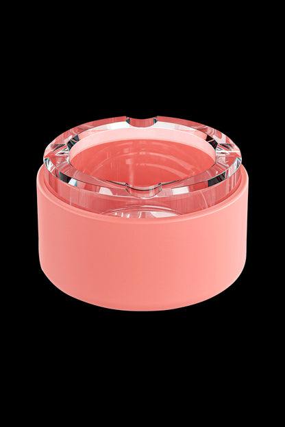 Coral-colored cannabis grinder with clear acrylic top.