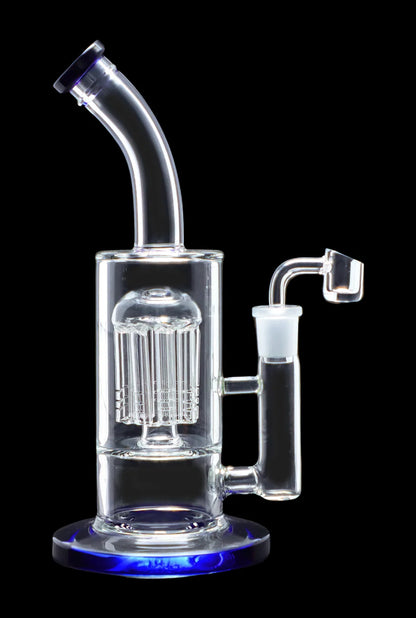 Glass rig with intricate percolator and quartz nail.
