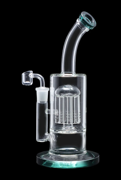 Clear glass bubbler with intricate perc diffusion and turquoise accents, isolated on black.