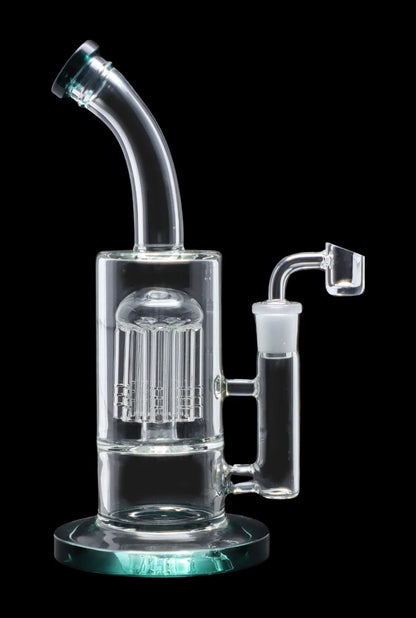 Clear glass water pipe (rig) with a complex perc filtration system and a quartz banger.