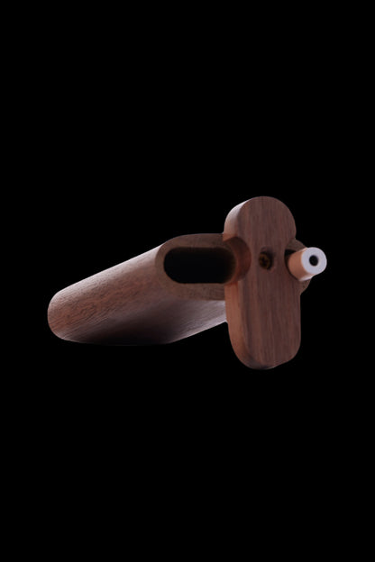 Wooden cannabis pipe with a rounded bowl and carved handle, isolated on a black background.