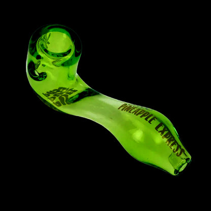 Angled close-up of a translucent lime-green Puff Puff Pass Sherlock Hand Pipe against a black background, showing the bowl, curved stem, and printed "PINEAPPLE EXPRESS" text