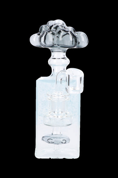 Clear glass bubbler water pipe with ornate floral design.
