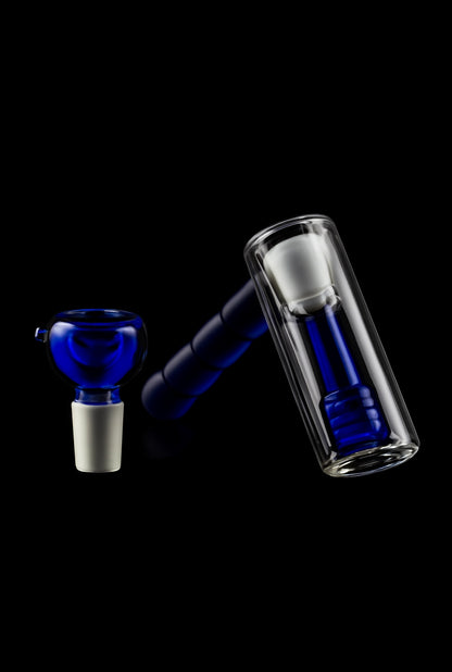 Blue glass bubbler and water pipe against a black background.