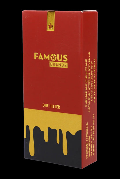 Red packaging for “Famous Brandz” one-hitter with a melting gold drip design and cannabis leaf details.