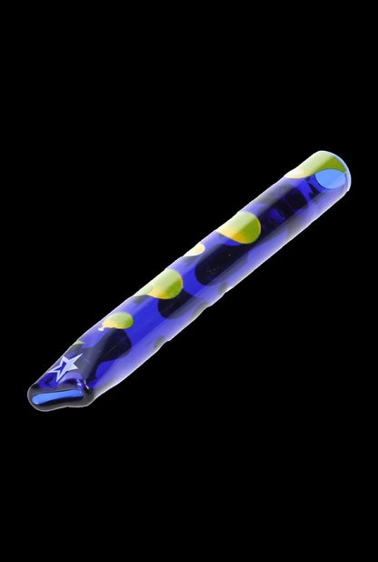 Blue and green patterned glass pipe isolated on a black background.