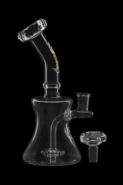 Clear glass water pipe (bong) with a glass bowl next to it, against a black background.