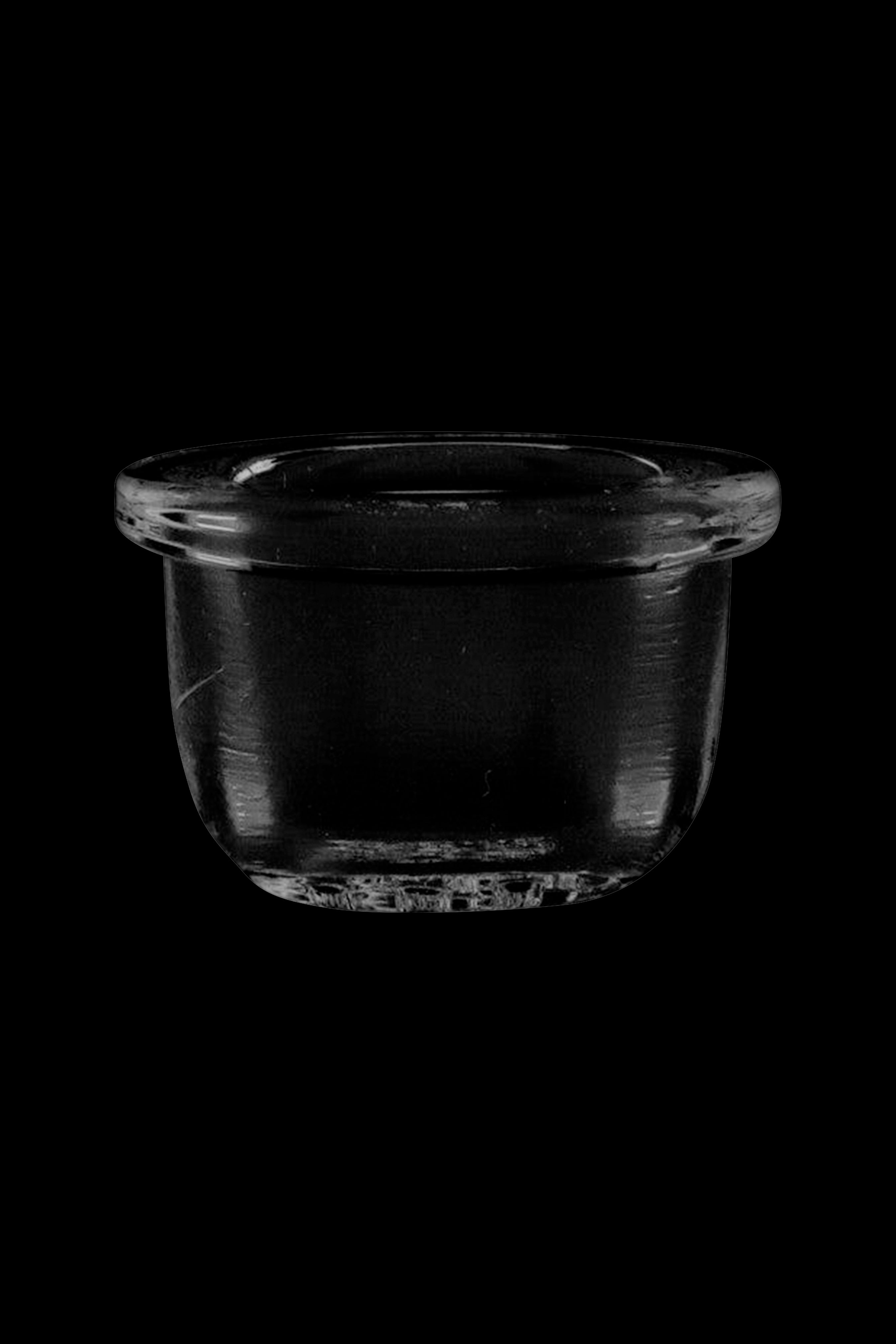 Clear glass dab dish isolated on black.