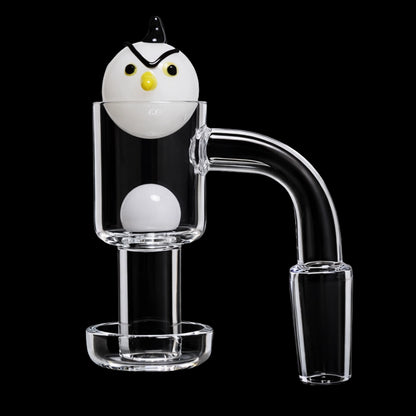 Close-up, front view of the Smoke Cartel Angry Bird Terp Slurper Banger Set - 14mm showing a white angry-bird carb cap seated atop the clear glass banger against a black background