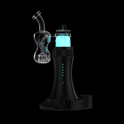 Close-up three-quarter view of the Switch™ Silicone Base showing a clear glass attachment and glowing cyan chamber against a black background