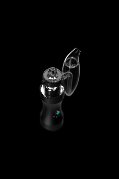Black cannabis dab rig with a glass bubbler attachment, illuminated with a blue light.