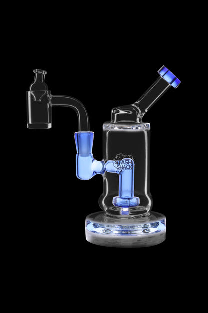 Blue glass dab rig with intricate design and clear base, isolated on a black background.