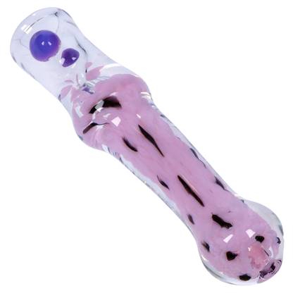 Angled close-up of the Smoke Cartel Frit Cone One Hitter - 3 in. showing a clear glass tube with pink fritted interior and two raised purple dots.