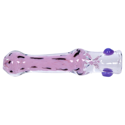 Side view of a clear glass Smoke Cartel Frit Cone One Hitter - 3 in. showing a central milky pink frit core with black streaks and three small purple glass dots.
