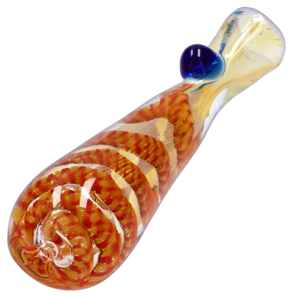 Angled close-up of the Smoke Cartel Piped and Fumed One Hitter - 3 in., showing a clear glass tube with orange-red spiral cane and a blue glass carb nub.