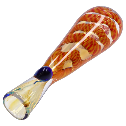 Angled close-up of the Smoke Cartel Piped and Fumed One Hitter - 3 in. showing orange twisted cane work inside clear glass and a blue glass carb.