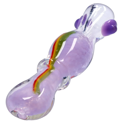 Angled close-up of the Smoke Cartel Frit Rasta One Hitter - 3 in., showing its clear glass with lavender frit and a thin red-yellow-green rasta stripe.