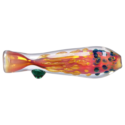 Side view of a clear glass Smoke Cartel Gold Dot One Hitter - 3 in. with an internal orange-red swirl, raised gold droplets and blue-green dot accents.