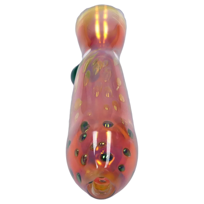 Top-down view of the Smoke Cartel Gold Dot One Hitter - 3 in. showing a pinkish iridescent glass surface dotted with raised gold-green spots.