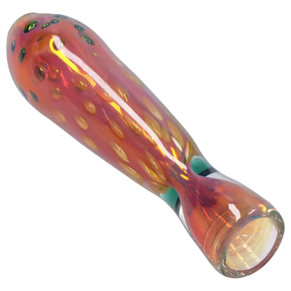 Angled close-up of the iridescent Smoke Cartel Gold Dot One Hitter - 3 in. showing its orange-pink glass surface with raised gold dots and glossy reflections