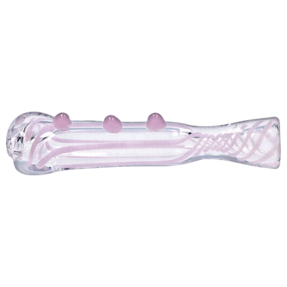 Side profile of the Smoke Cartel Slime Line One Hitter - 3 in., a clear glass tube with pale pink internal ribbons and three raised pink glass dots along its top.
