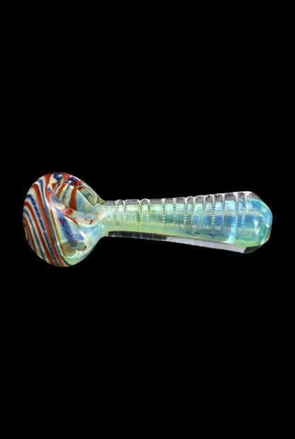 Side view of the Smoke Cartel Engraved Fumed Spoon Pipe - 3 in. showing a red-striped rounded bowl and an iridescent engraved stem against a black background