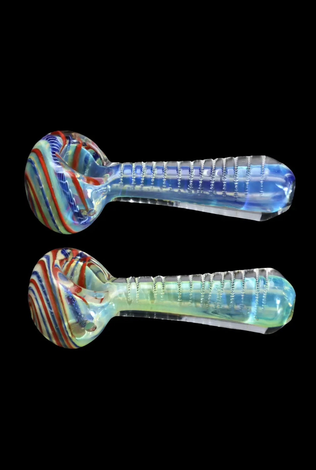 Side view of two mirrored Smoke Cartel Engraved Fumed Spoon Pipe - 3 in. pieces showing colorful swirled bowls and ribbed translucent blue-green handles on black background