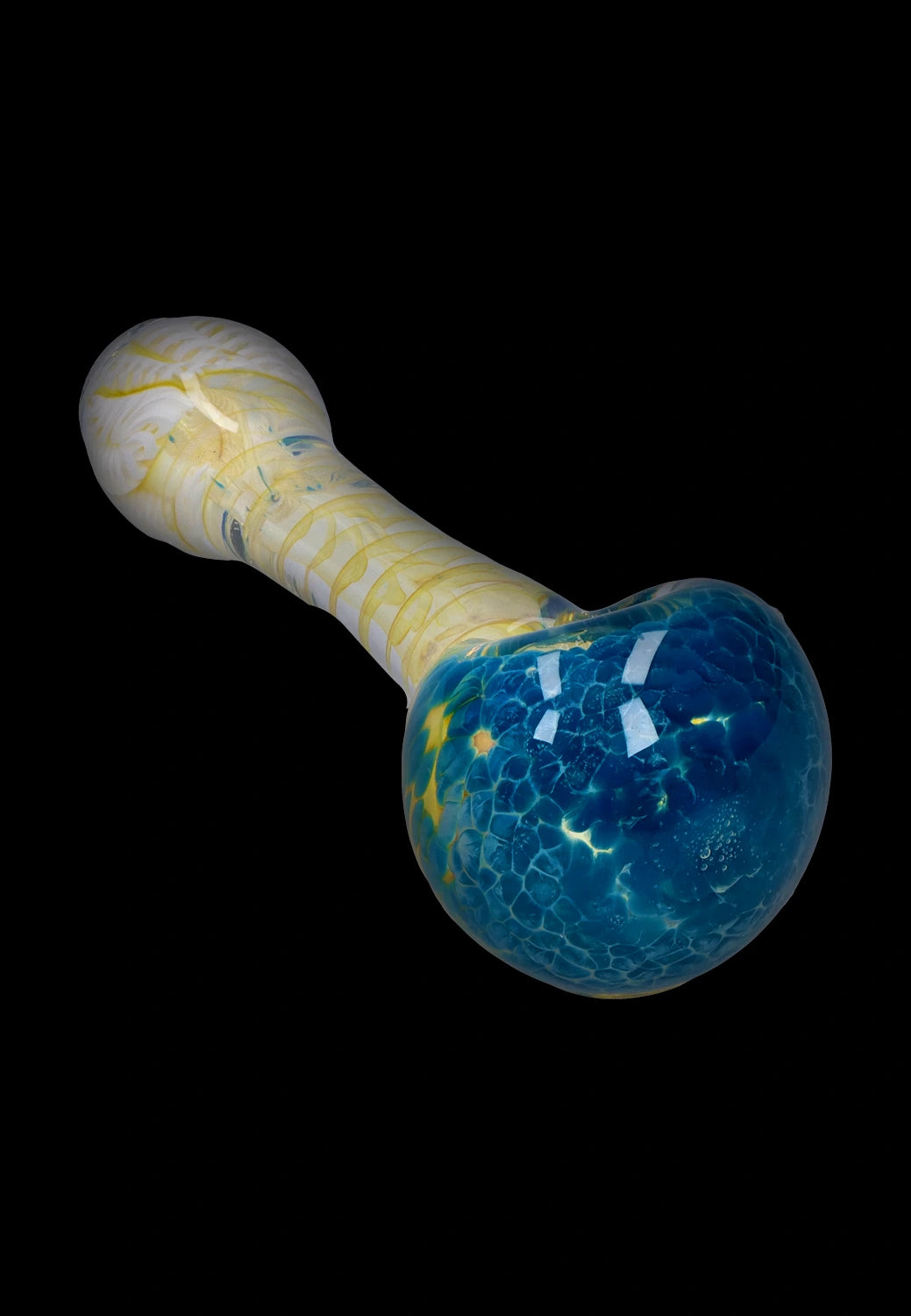 Angled close-up of the Smoke Cartel Twisting Frit Spoon Pipe - 3 in. showing a blue frit bulb and a pale yellow swirled stem against a black background