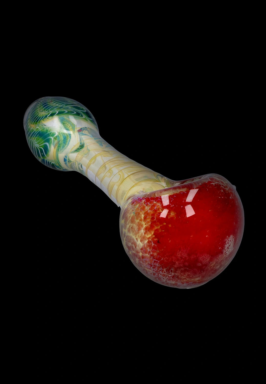 Angled close-up of the Smoke Cartel Twisting Frit Spoon Pipe - 3 in. showing a glossy red bowl, pale swirled stem, and green patterned mouth end against black background