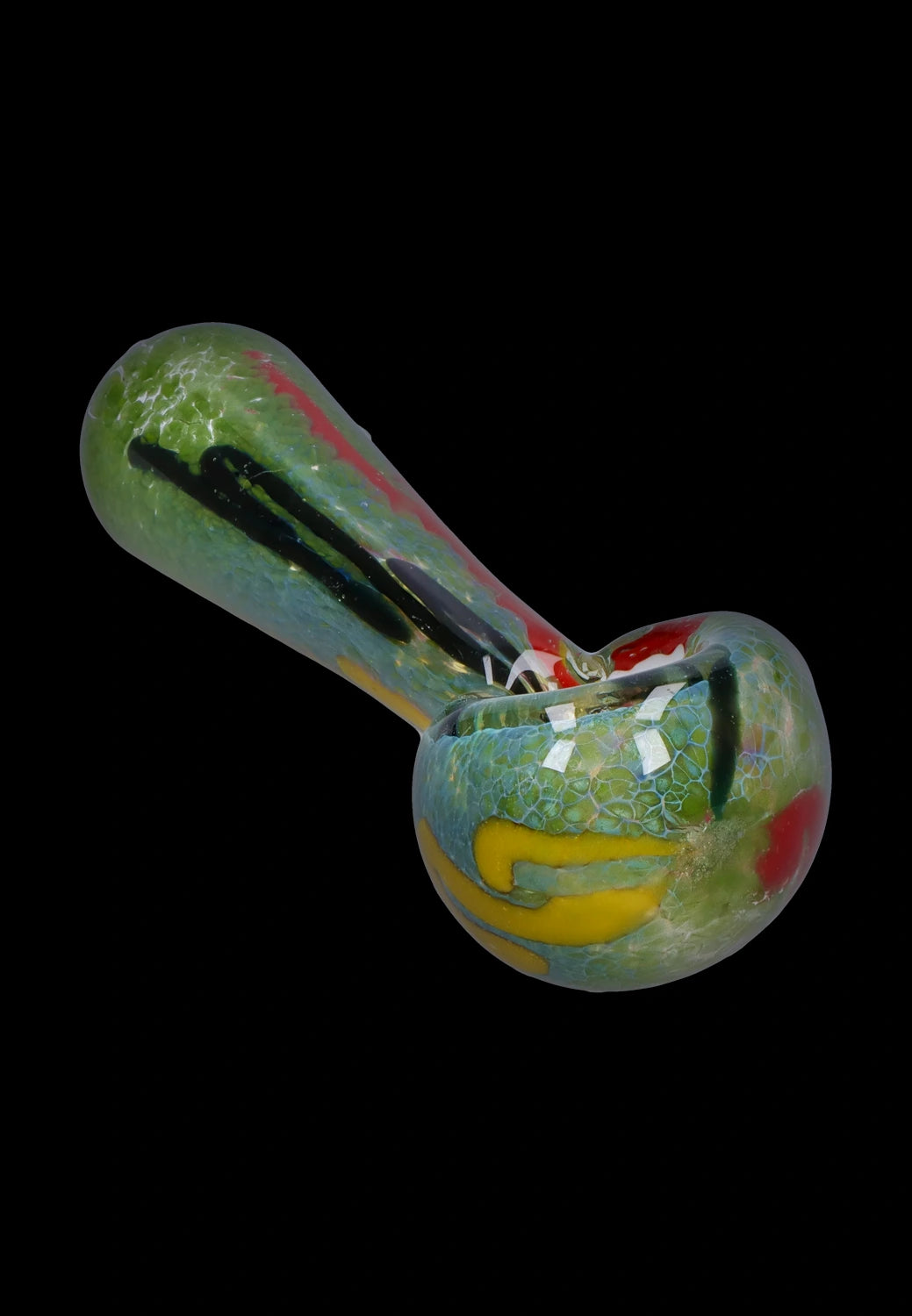 Angled close-up of the Smoke Cartel Color Frit Spoon Pipe - 3 in., showing its green mottled glass bowl with yellow and red accents.