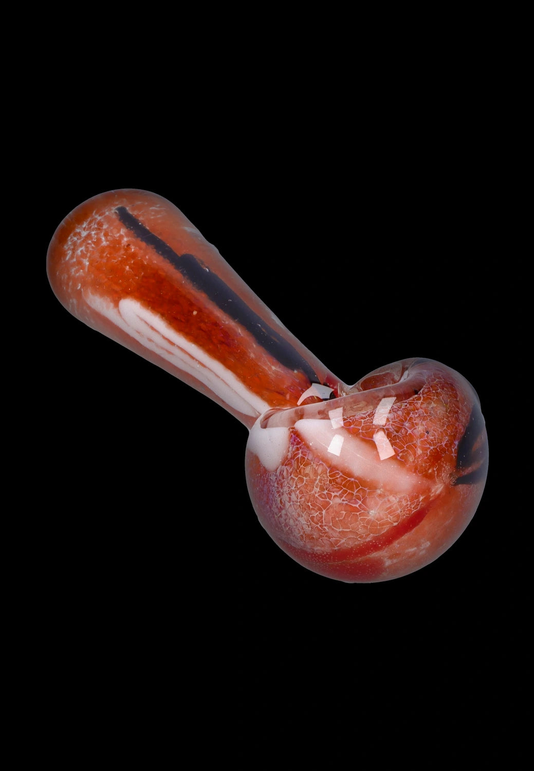 Angled close-up of a red and white Smoke Cartel Color Frit Spoon Pipe - 3 in. showing its rounded bowl, long stem, and crackled frit texture on a black background