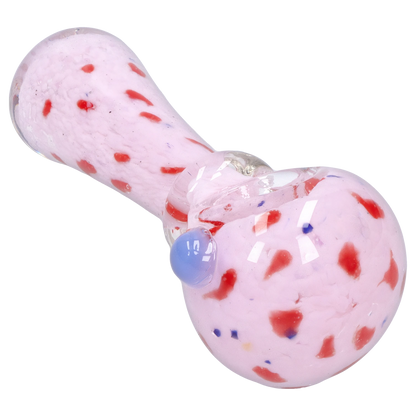 Angled close-up of the Smoke Cartel Frit with Twisted Mouthpiece Spoon Pipe - 4 in., showing its pink glass body with red flecks, clear twisted mouthpiece, and blue glass carb.