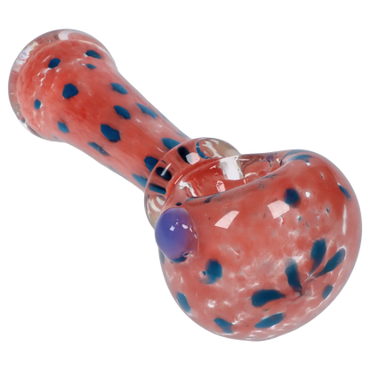 Angled close-up of the Smoke Cartel Frit with Twisted Mouthpiece Spoon Pipe - 4 in., showing its pink glass body with scattered blue frit dots and a glossy rounded bowl.