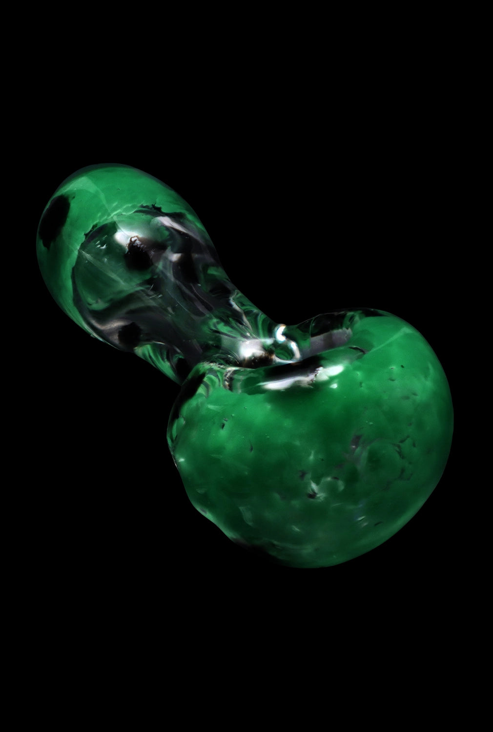 Angled close-up of the Smoke Cartel Colour Frit with Dots Spoon Pipe - 2.5 in. showing glossy green glass with dark speckled dots against a black background