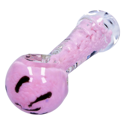 Close-up angled view of the Smoke Cartel Frit Marble Rim Pastel Spoon Pipe - 3.5 in., showing its pink marbled bowl and clear glass stem with pastel frit accents.