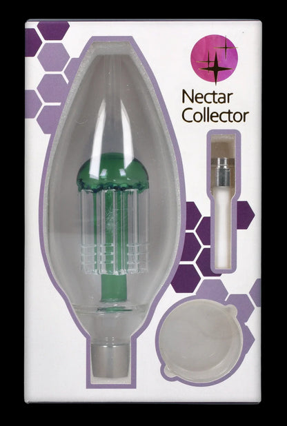 Front-facing shot of the Smoke Cartel Egg With Tree Perk Blue Nectar Collector centered in its white and purple hex-patterned packaging, showing the green tree-perk visible through a clear egg-shaped window.