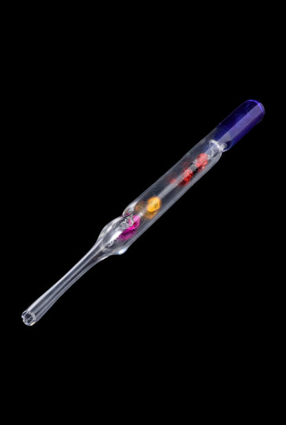 A diagonal view of the SC Glass Straw with Beads, showing colorful beads encased within the clear glass tube.
