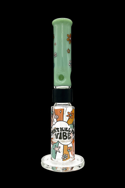 A vibrant green glass water pipe (bong) with colorful floral designs and text reading “Don’t Kill My Vibe.”