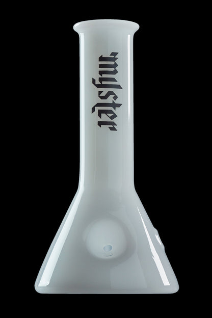 Frosted glass beaker with “mystery” text vertically down the neck.