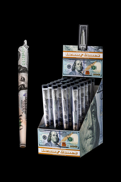 Display of “Benny Cones” pre-rolled cones packaged to resemble stacks of $100 bills, with a single rolled cone in the foreground.