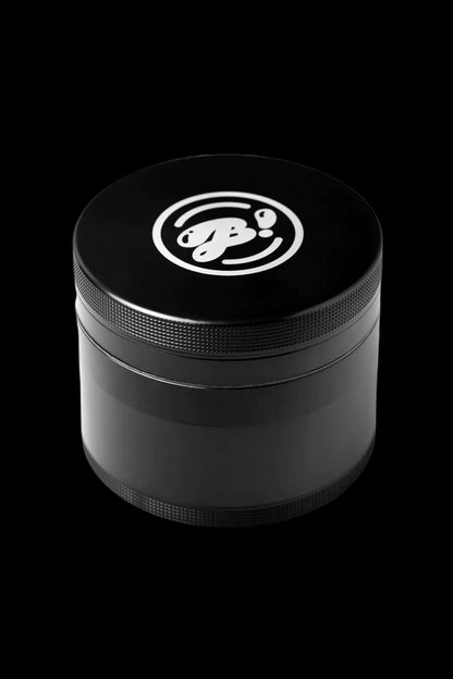 Black metal cannabis grinder with a white logo.