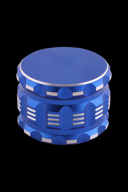 Blue metal cannabis grinder on a black background.