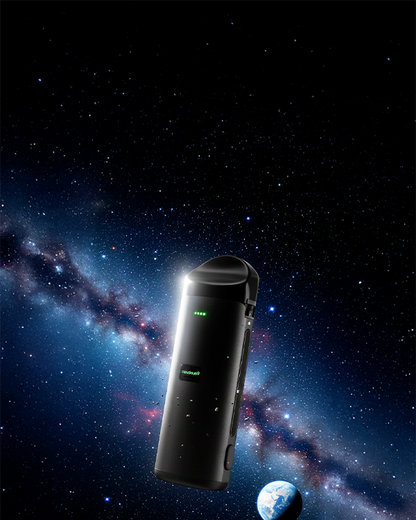 Slightly angled view of the black Cloudious 9 Atomic9 Dry Herb Vaporizer floating against a starry Milky Way backdrop.