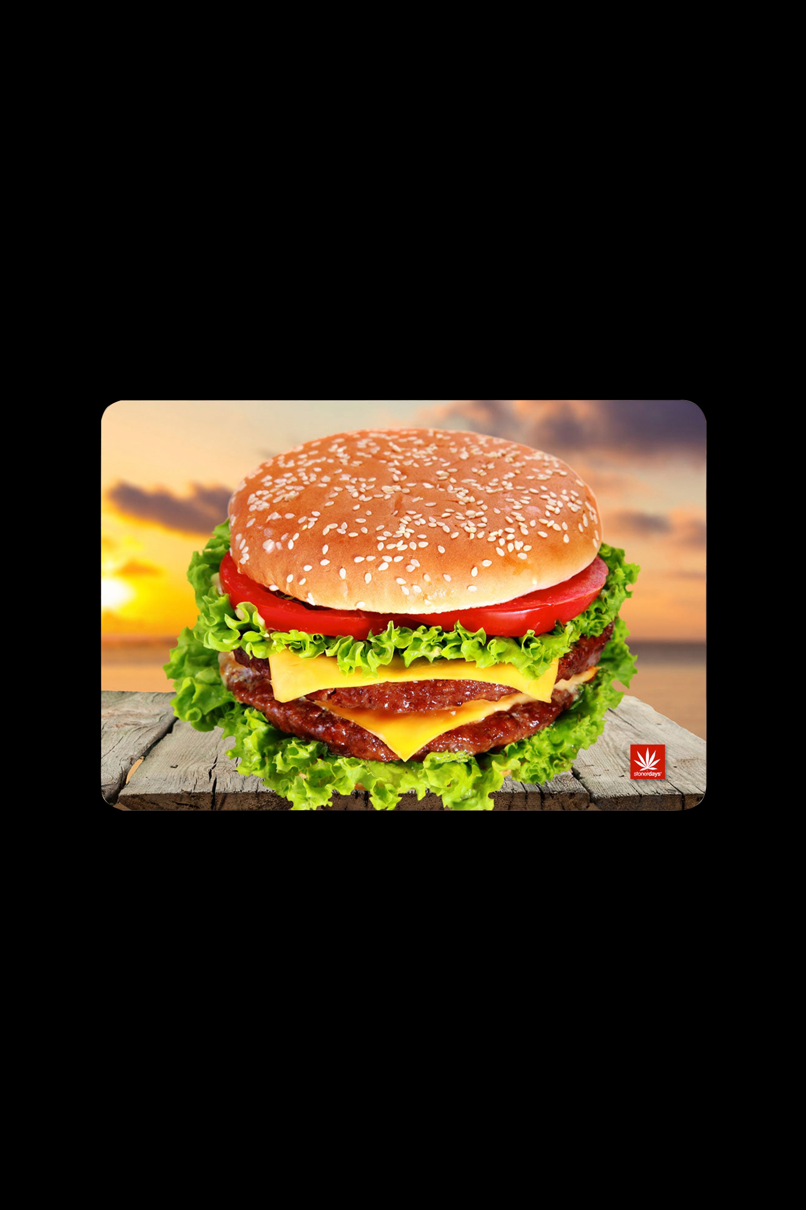 A vibrant, oversized burger advertisement with a cannabis leaf logo in the corner.