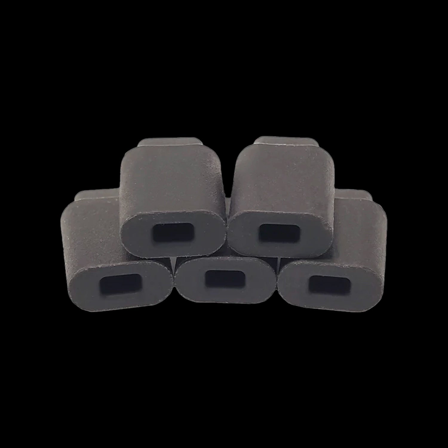 Close-up front view of six black Cipher Herby Insulating Mouthpiece Tips stacked in a pyramid against a black background.