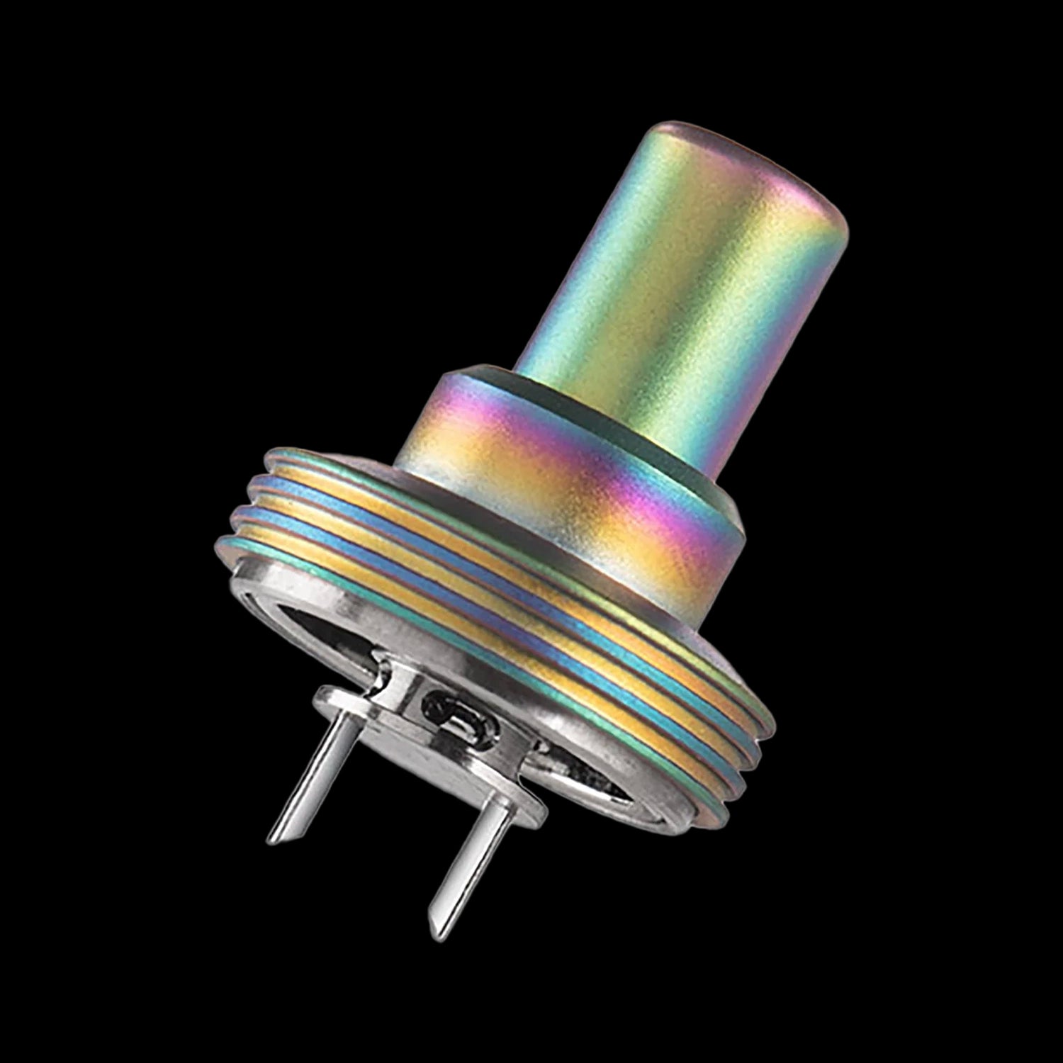 Diagonal close-up of the iridescent Cipher NOVA Replacement Mouthpiece - V2 showing its rainbow-finished cylindrical top, threaded base rings, and two metal pins against a black background