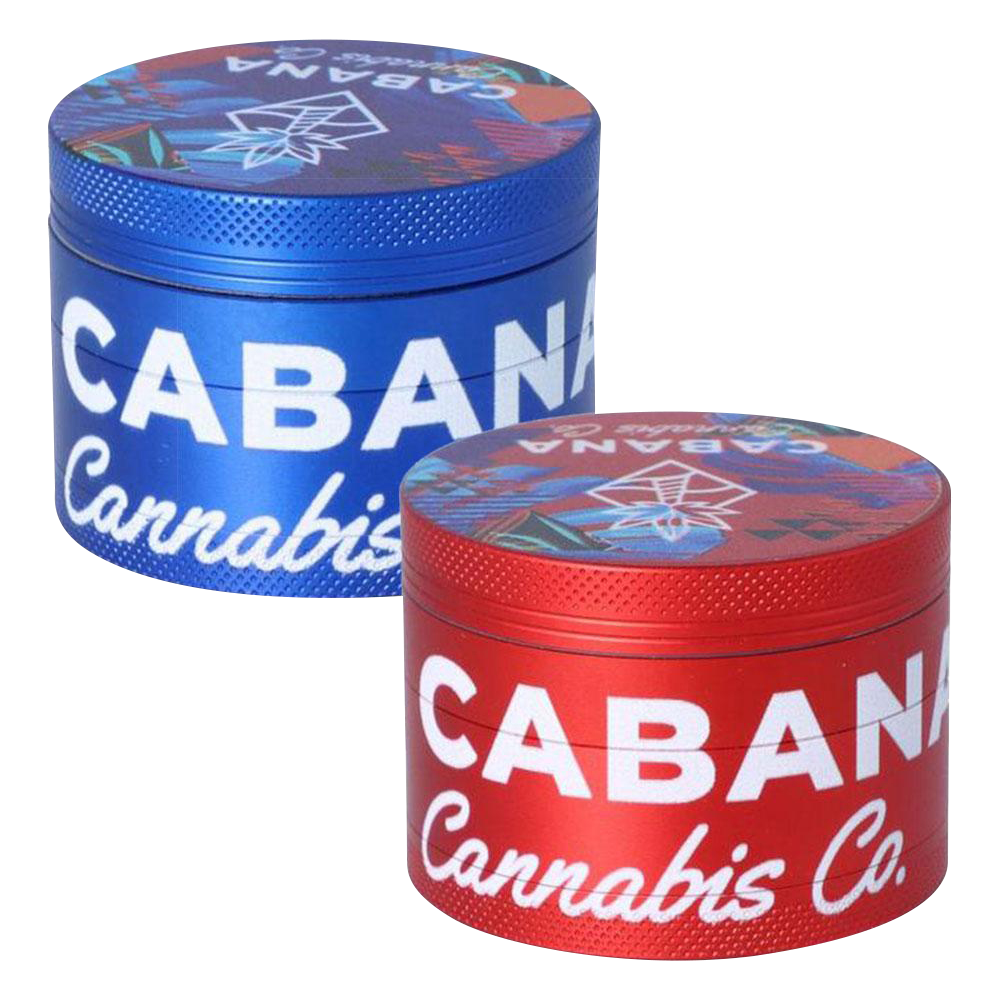 Front view of the Cabana Cannabis Co. 3 Stage Grinder - The Dawn, displaying a colorful, patterned top against a dark metallic body.
