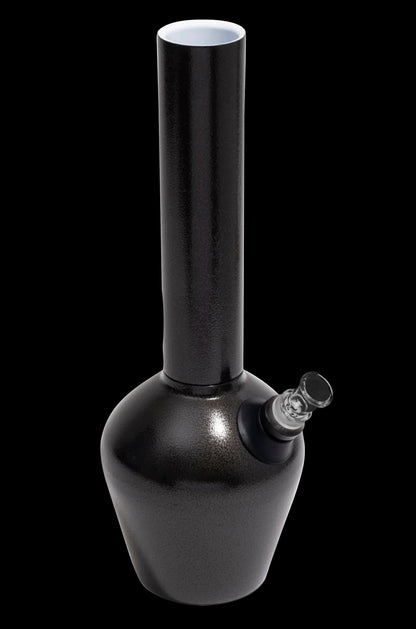 Black glass water pipe (bong) with a clear glass mouthpiece, isolated on a black background.